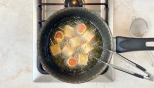 Enroladinho de salsicha com massa de pastel – Passo 6